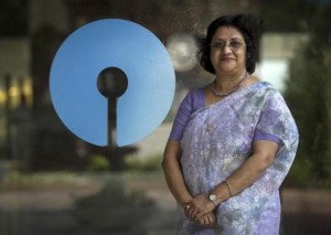 Arundhati Bhattacharya, Chairman of the State Bank of India, poses with the company's logo at the bank's headquarters in Mumbai March 24, 2015. REUTERS/Danish Siddiqui