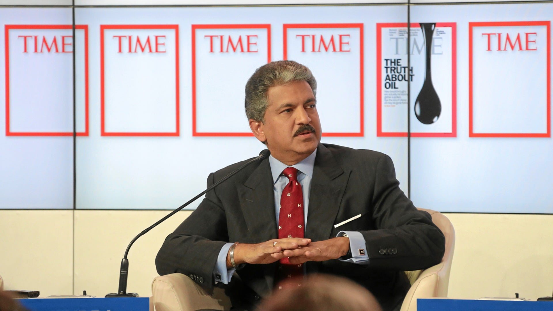 Mahindra Group Chairman Anand Mahindra seated on a panel at the World Economic Forum in Davos, 2013