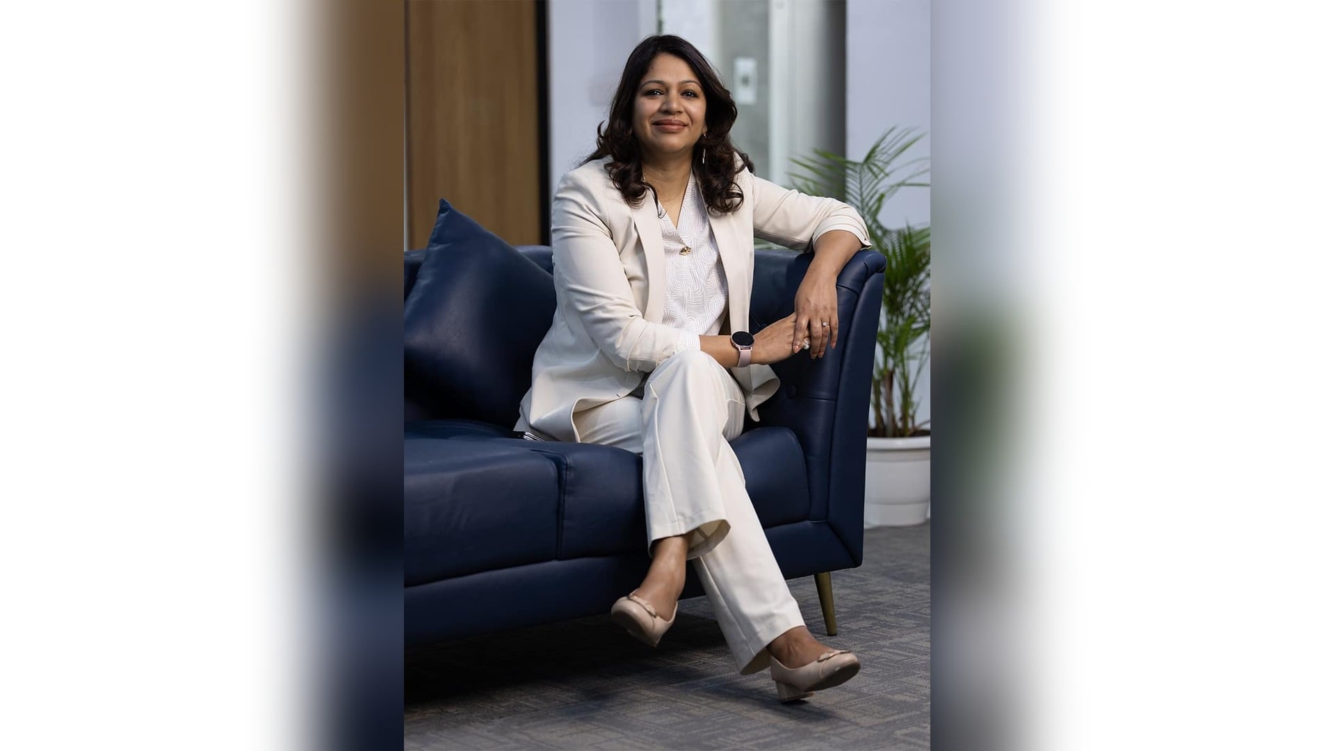 Santosh Agarwal, Director of PB Money and CEO of Paisabazaar, seated on a navy sofa in an office