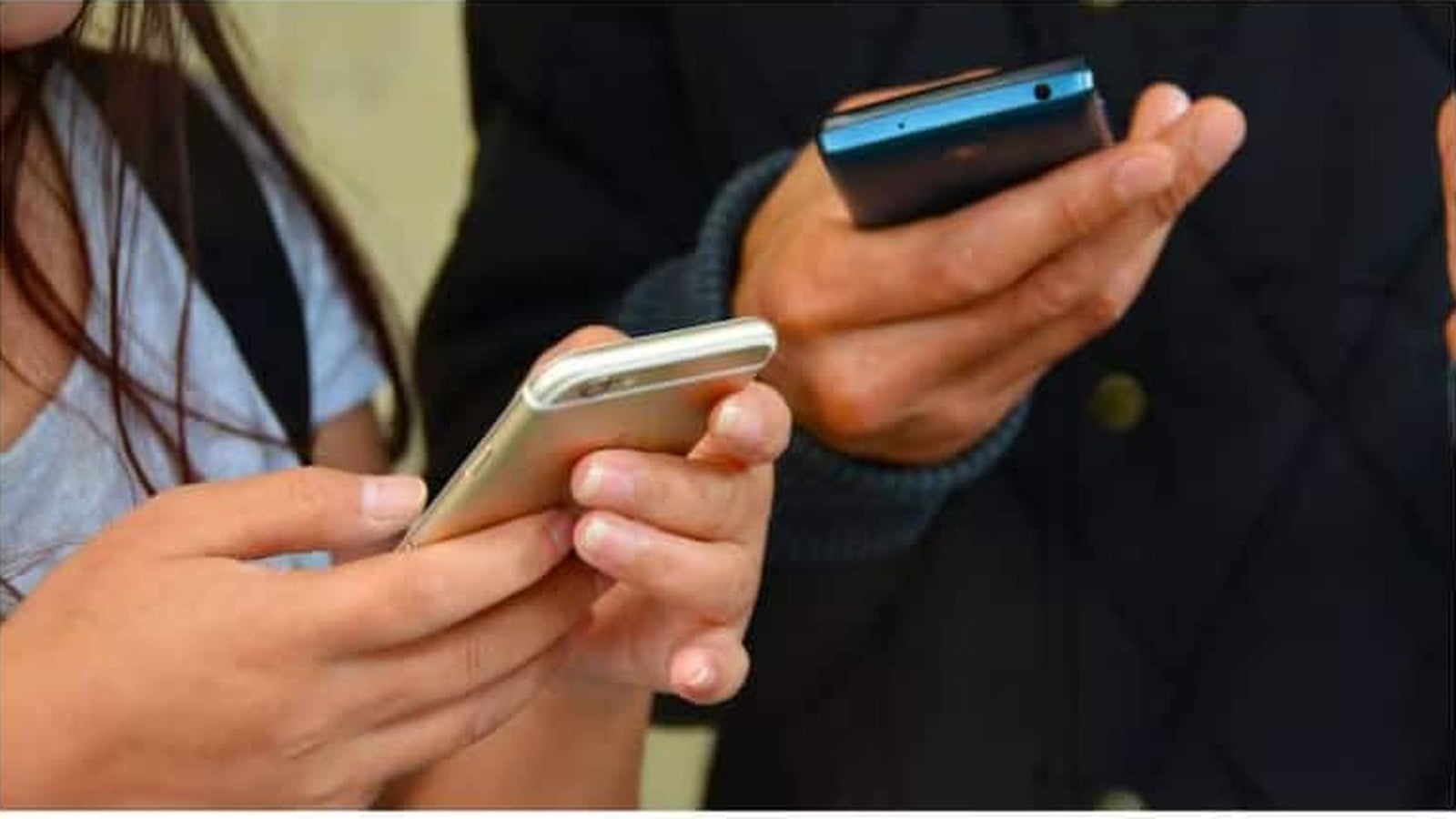 Smartphone users browsing apps on their phones
