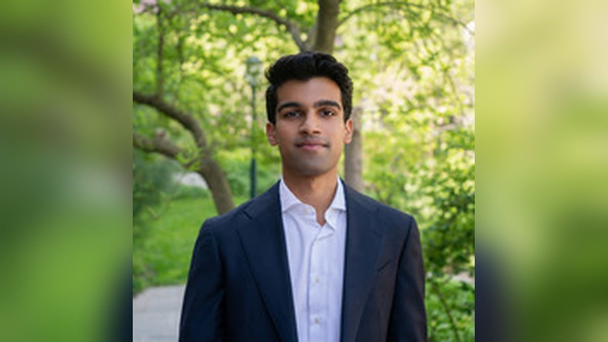 Arnav Ghatiwala, founder and CEO of Vouch, in a navy blazer outdoors